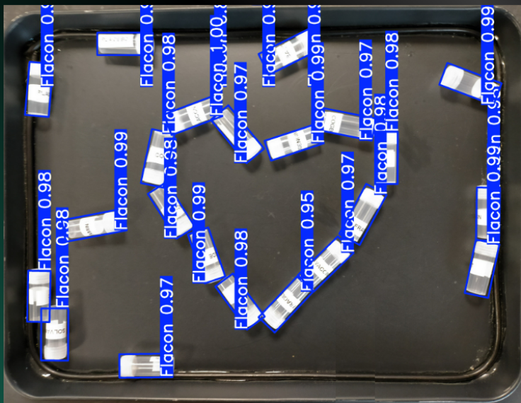 A bright pink sheet of paper used to wrap flowers curves in front of rich blue background
